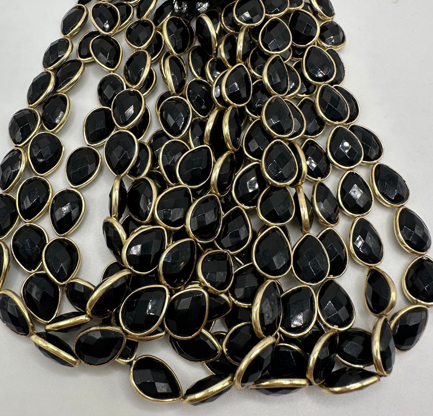 Black spinel facetted pear