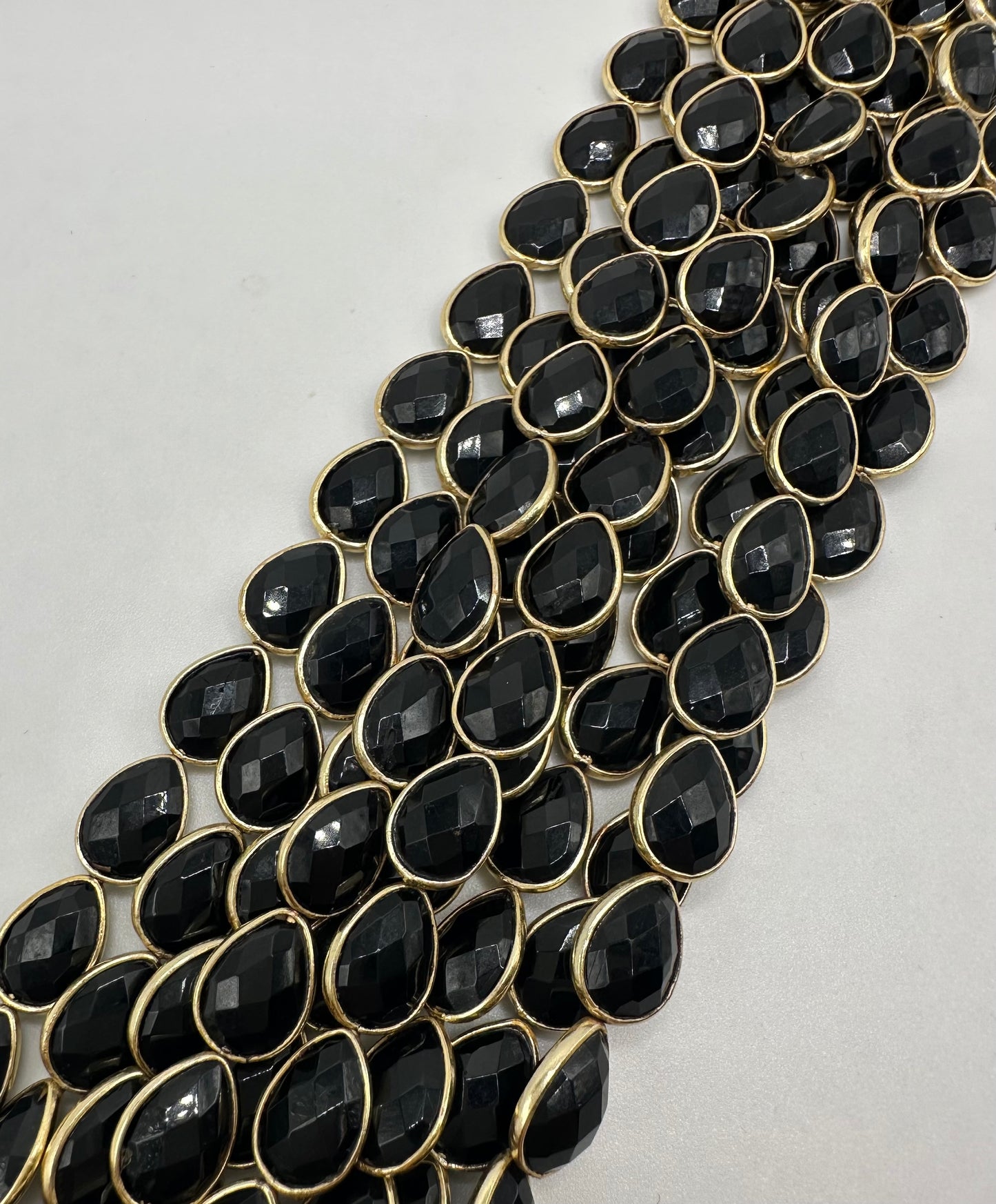 Black spinel facetted pear