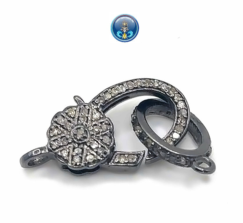 Pave diamond with rhodium plated sterling silver clasp