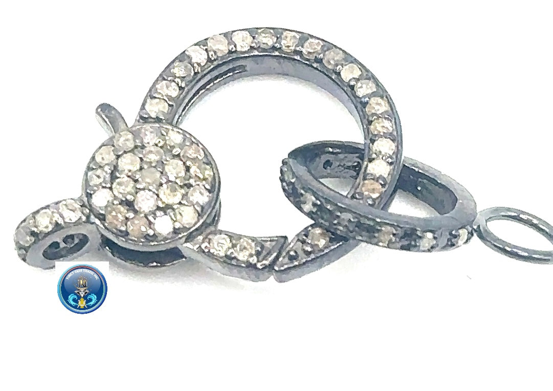 Pave diamond with rhodium plated over sterling silver clasp