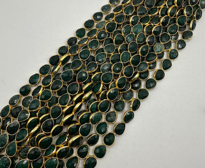 Emerald facetted pear 7x9mm bezel