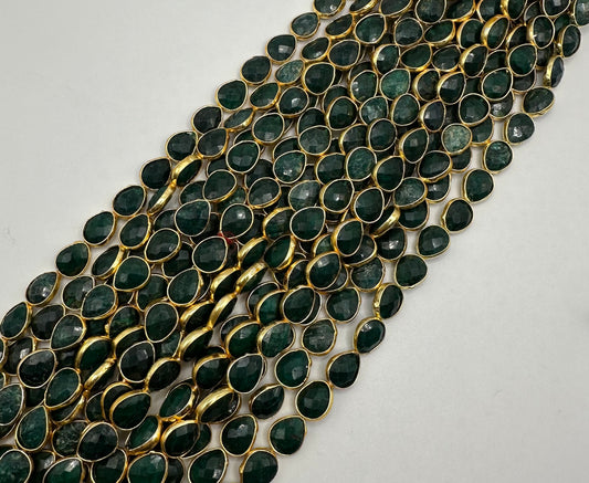 Emerald facetted pear 7x9mm bezel