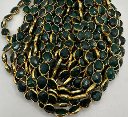 Emerald facetted pear 7x9mm bezel