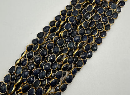 Sapphire facetted pear 7x9mm bezel