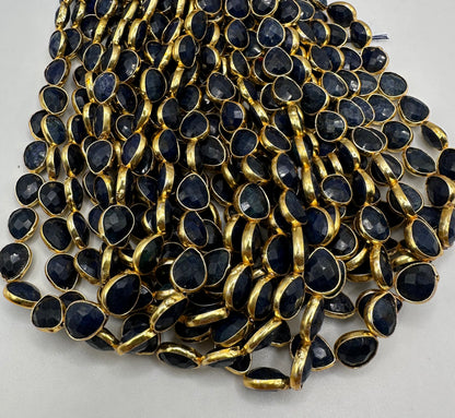 Sapphire facetted pear 7x9mm bezel