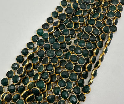 Emerald facetted heart 7mm bezel.