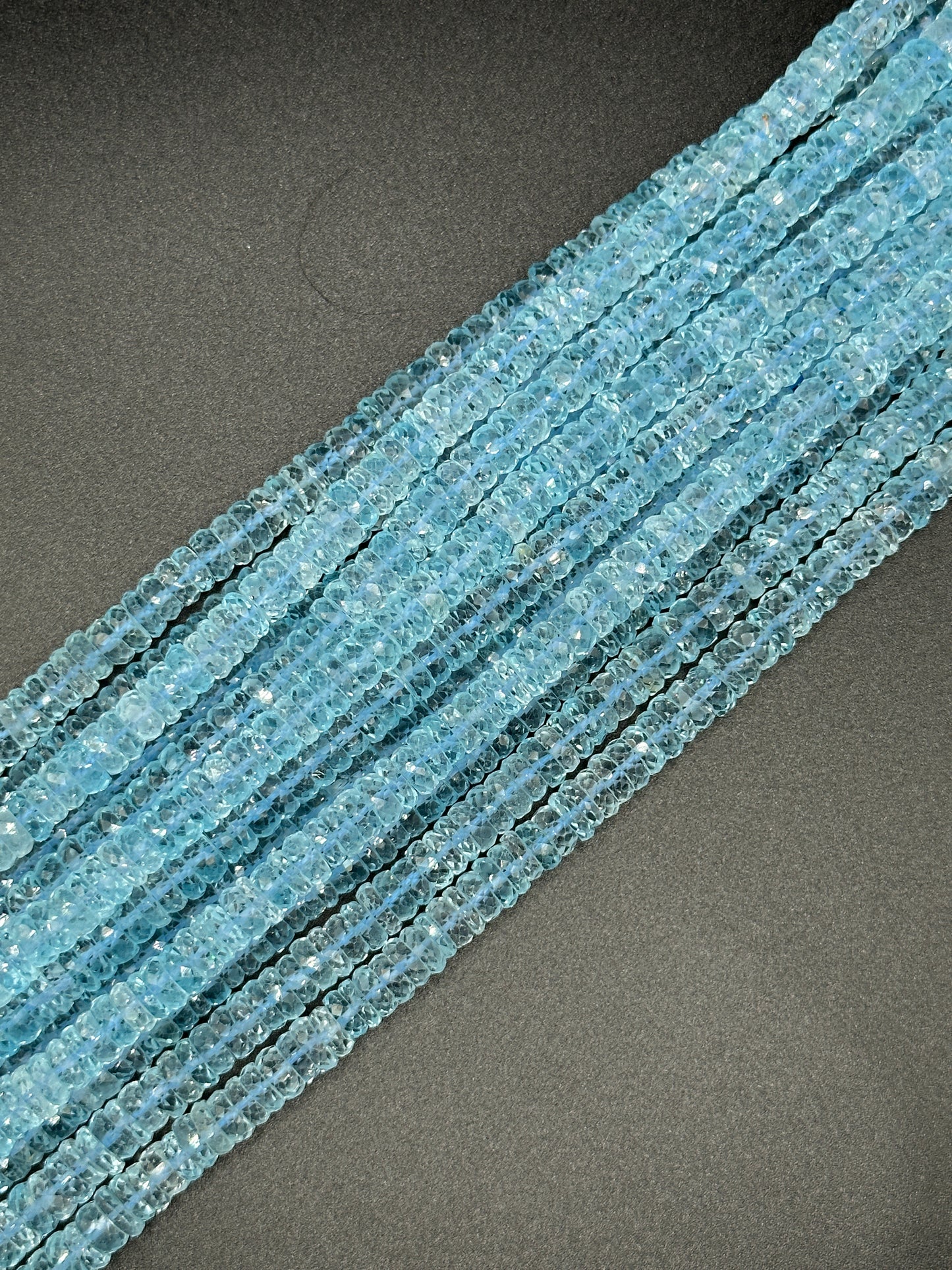 Blue Topaz faceted disc